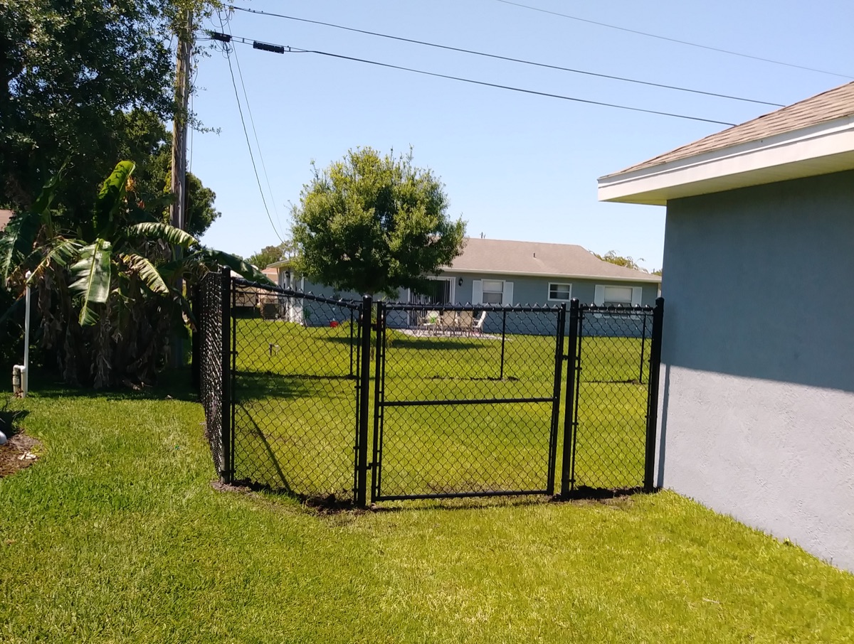 Chain-link fence enclosing a residential yard