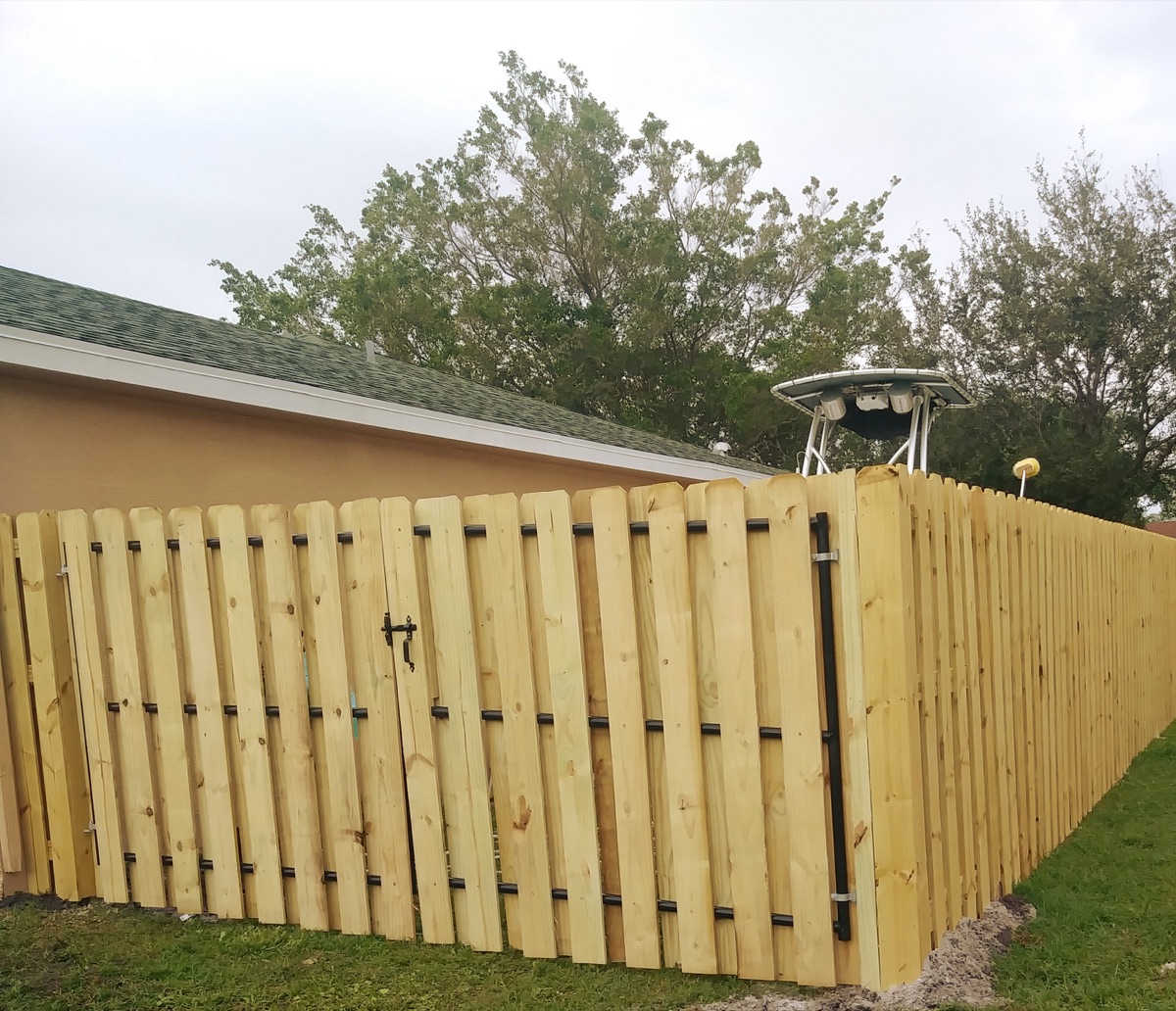 Wood privacy fence installation